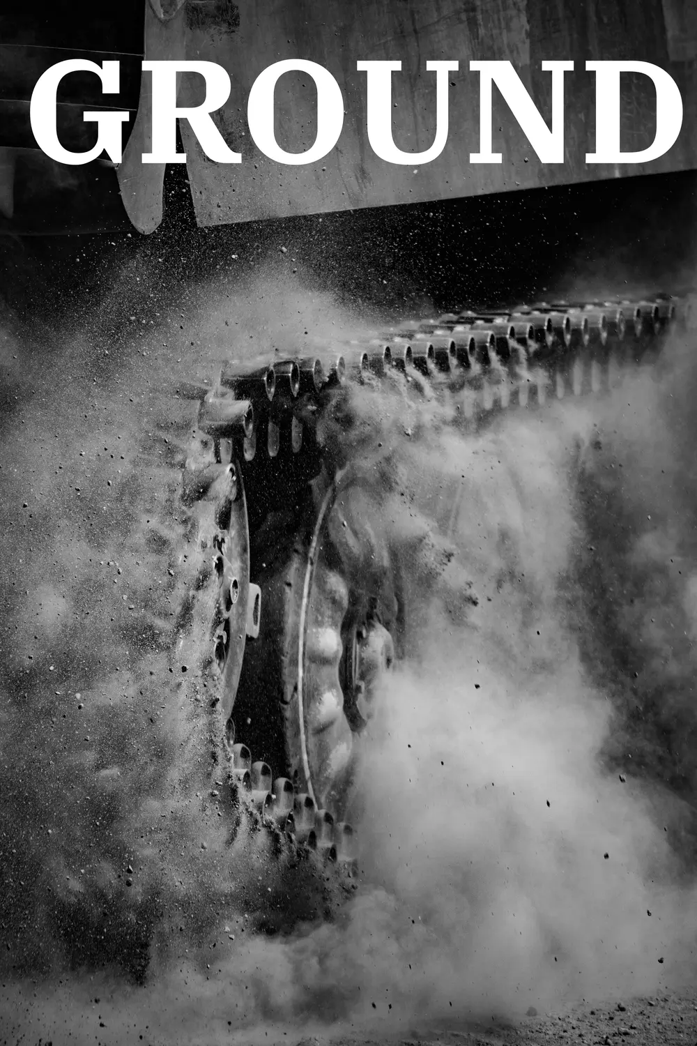 Ground: a tracked vehicle churning up dust and gravel