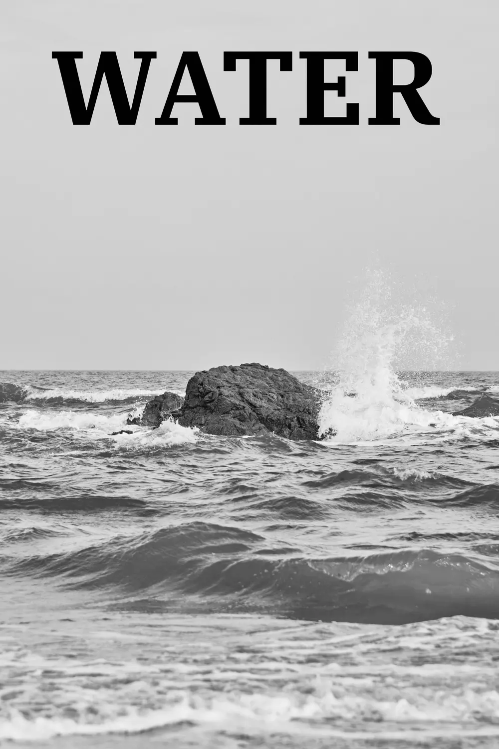 Water: waves breaking against a rock at sea