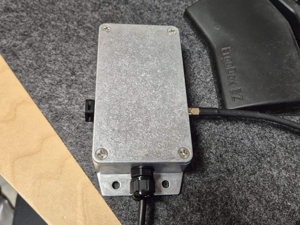 The finished unit: a diecast aluminium box with an SMA connector for PPS and a cable gland for USB